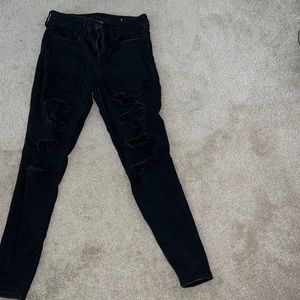Solid Black American eagle low rise jeggings with rips